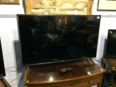 A LG TV, with remote