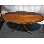 A reproduction oval coffee table