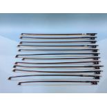 Twelve unnamed violin bows