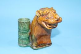 An ochre figure of a Lion, 13cm height x 10cm width approx.