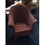 A Lloyd Loom pink armchair