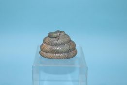 A soapstone seal, modelled as a snake, 6cm height x 8cm width approx.