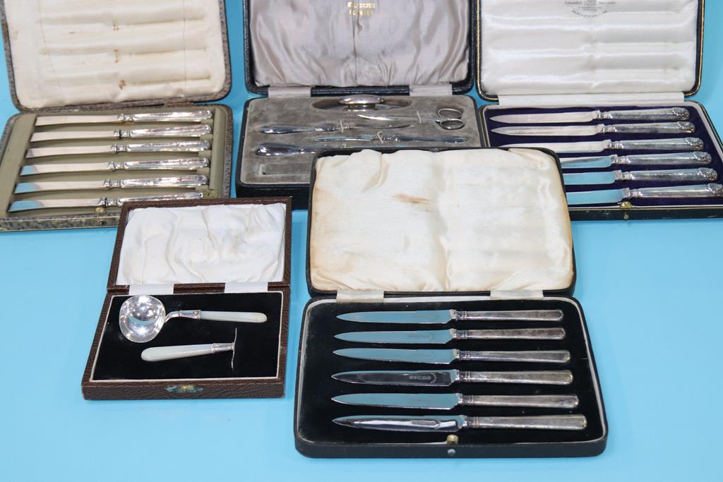 A quantity of cased cutlery, silver etc.