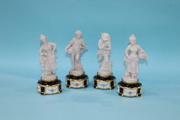 A set of four Capo Di Monte 'Four Seasons' figures