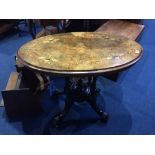 A small Victorian walnut oval centre table, with quarter top and marquetry decoration, 92cm width