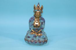 A glazed figure of a Buddha, 26.5cm height x 15cm width approx.