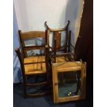 An oak wall cabinet and a collection of chairs