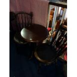 A pair of Bentwood chairs and a tripod table