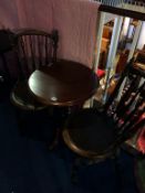 A pair of Bentwood chairs and a tripod table
