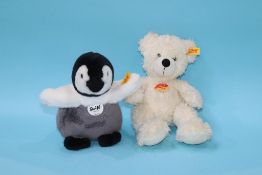 A white Steiff Bear and a Steiff Penguin