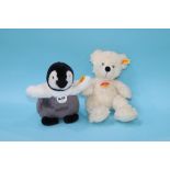 A white Steiff Bear and a Steiff Penguin