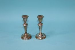 A pair of silver candlesticks, A.L. Davenport, Birmingham, 1955