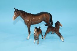 A Beswick horse and two foals