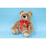 A modern brown Steiff teddy bear with red ribbon, number 018329