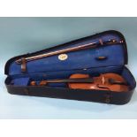 A violin labelled Medio Fino and hard case, 34cm (length of back)