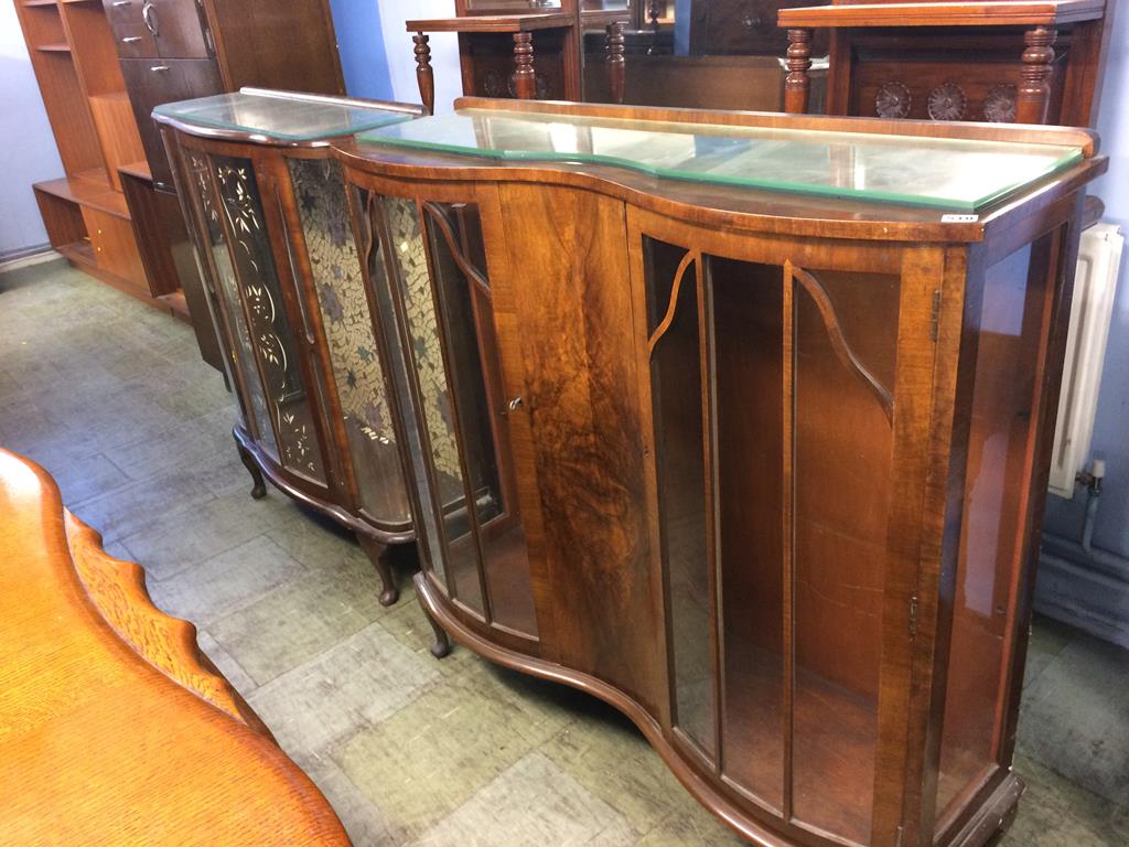 A walnut china cabinet and another china cabinet