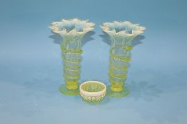 A pair of Victorian Vaseline glass spill vases, with flared rim and a salt