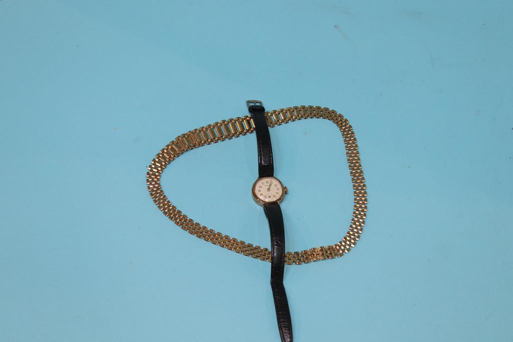A 9ct gold necklace, 26.4 gram and a 9ct ladies watch