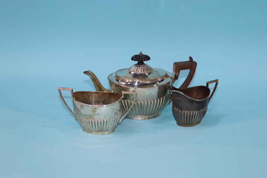 A silver three piece tea-set, Walker and Hall, Sheffield, 1922, 18 oz