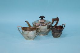 A silver three piece tea-set, Walker and Hall, Sheffield, 1922, 18 oz