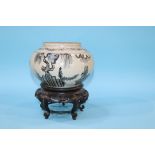 An Oriental bowl on hardwood stand, 23cm height x 21cm width approx.