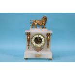 An alabaster mantel clock, surmounted by a lion, 37cm height