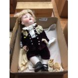 An Armand Marseille bisque doll, German, c. 1925, impressed 990 A 13 M, weighted brown eyes, wearing