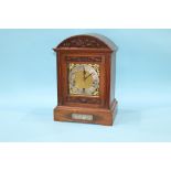 An oak bracket clock with eight day movement, with strike action, by Goldsmith Company, 41cm height