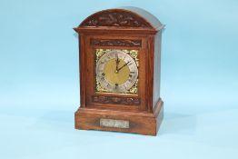 An oak bracket clock with eight day movement, with strike action, by Goldsmith Company, 41cm height