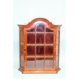 A small Dutch marquetry hanging wall cabinet with domed top, canted sides and three shelves, 60cm