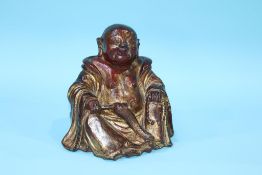 A gilt stoneware Buddha, 16.5cm height x 17.5cm width approx.