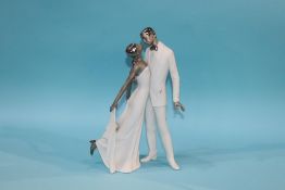 A modern Lladro figure of a young courting couple