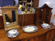 A small two door wall cabinet, mirror and blue and white china etc.