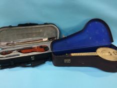 A John Greg and sons banjo and case, and a Chinese violin