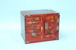 An Oriental lacquered cabinet
