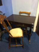 A reproduction sofa table and two chairs