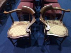 A pair of Edwardian mahogany corner chairs