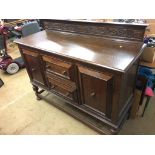 A carved oak sideboard