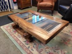 A large drift wood style coffee table with glass centre, 150cm x 90cm