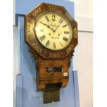 A walnut and brass inlaid dial clock by A. Kusse of Newcastle