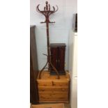 A pine chest of drawers, coat stand etc.