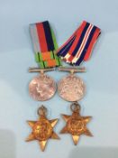 A group of four World War II medals, unnamed