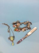 A silver penknife, charm bracelet etc.