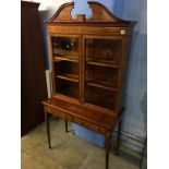 A good quality Edwardian china display cabinet, with broken pediment, two glazed doors below two