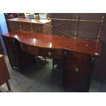 A 19th century mahogany bowfront pedestal sideboard, with brass gallery, 198cm wide