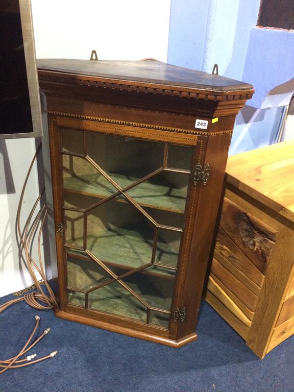 An oak corner cabinet and a mahogany corner cabinet