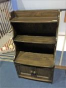 An Ercol waterfall bookcase, 61cm wide