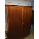 A modern bow front wardrobe, 145cm wide, 65cm deep