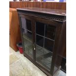 An oak leaded glass bookcase, 91cm wide