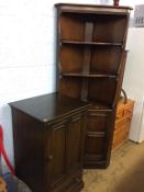 An Ercol corner cabinet and hifi cabinet